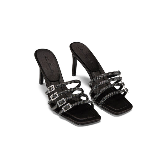 black sandals with 4 black straps, each featuring rhinestone details and chic buckles.